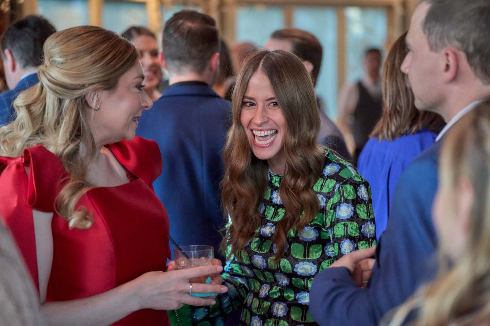 Guests laughing and talking together at a corporate event that a Core Visuals crew is photographing on assignment