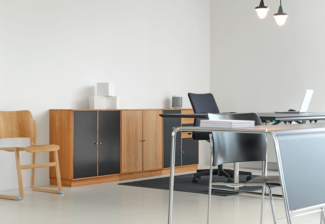 Clean, organized modern office space with stylish furniture and neutral decor