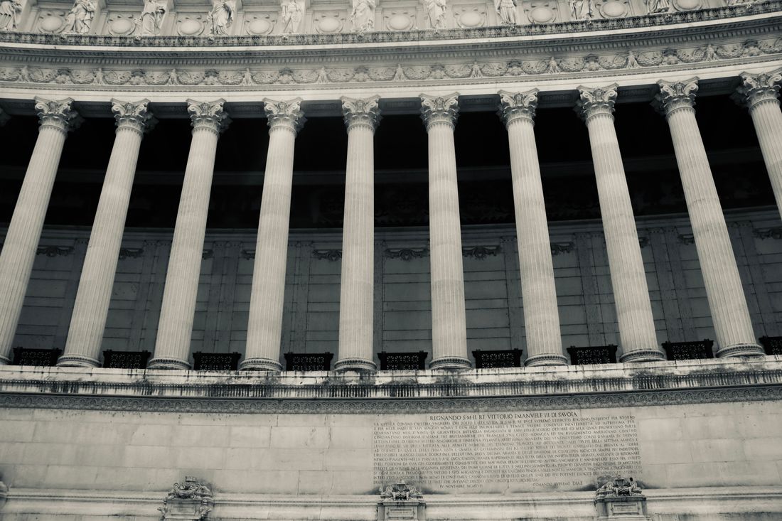 Neoclassical stone columns on a civic building facade, the kind of monumental architecture common to city and state government offices.