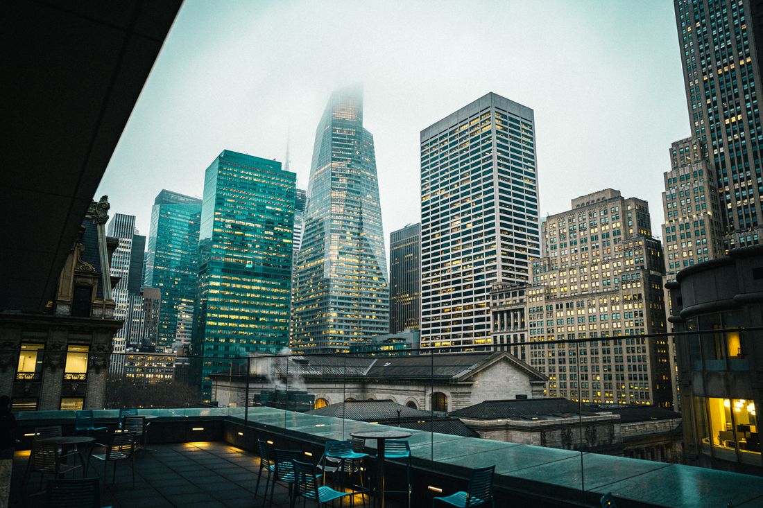 Misty New York City skyline showing iconic skyscrapers from a rooftop perspective