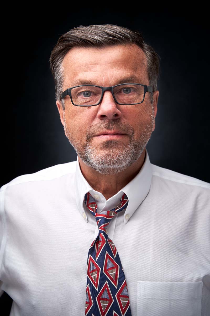 Middle-aged man serious professional headshot NYC