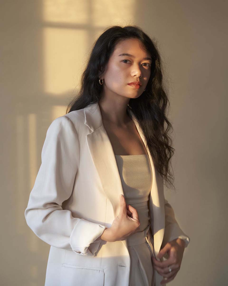 Woman beige blazer atmospheric editorial portrait NYC