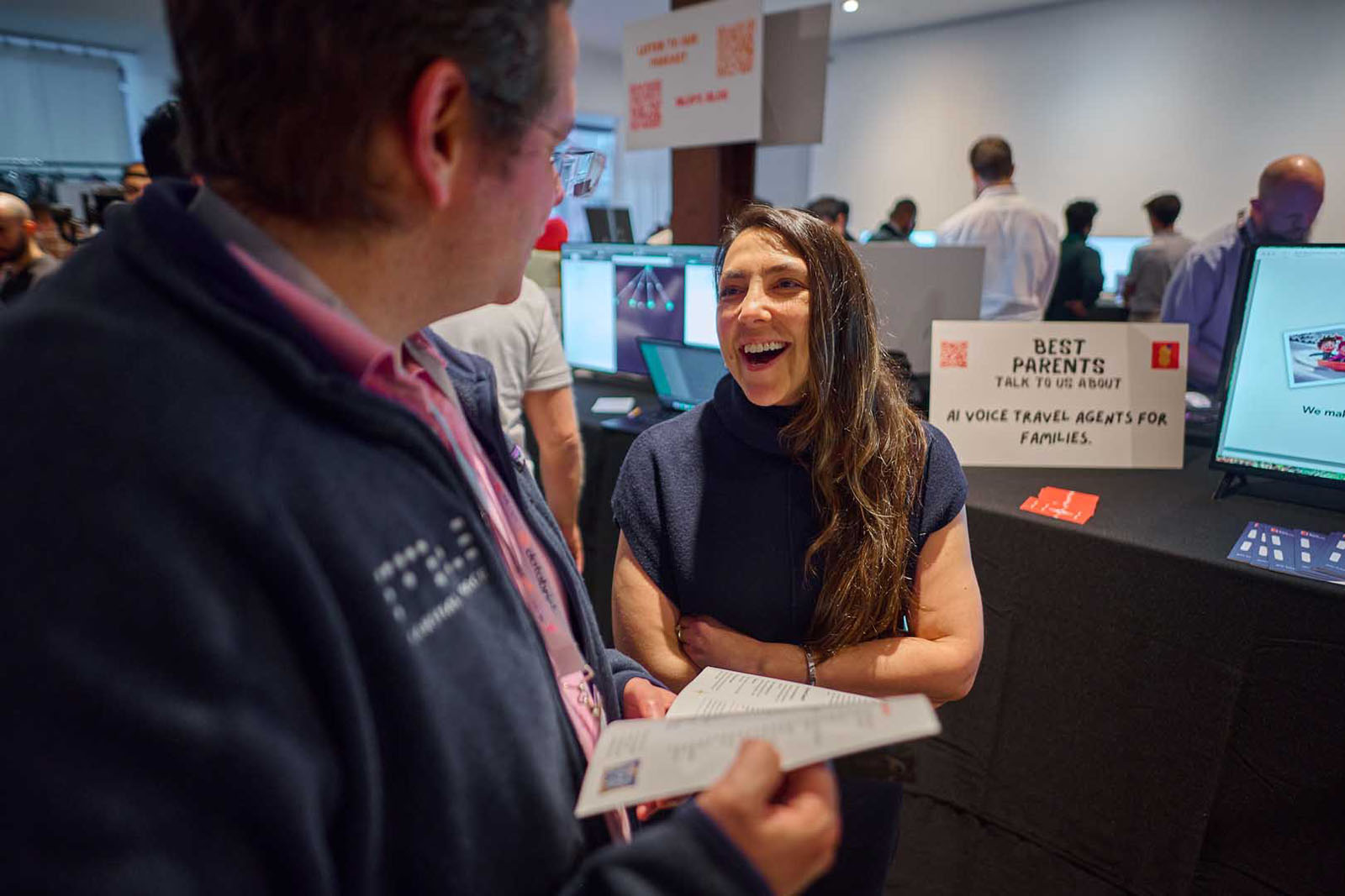Professional networking event NYC business conversation candid photo